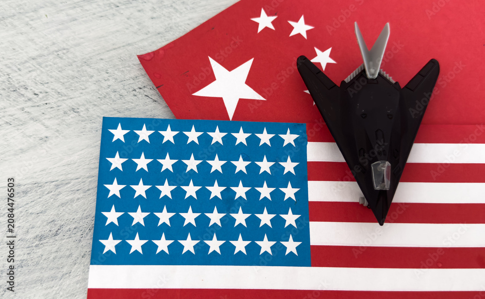 Fototapeta premium Toy airplane fighter bomber with China flag background