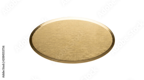 Elegant oval shaped metallic plaque with a brushed gold texture isolated on a clean white background