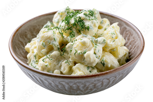 Delicious homemade potato salad with mayonnaise garnished with dill in wooden bowl