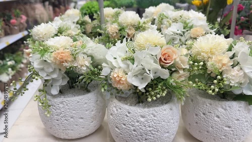 Elegant White Floral Arrangements Displayed Inside Modern Garden Center Retail Store