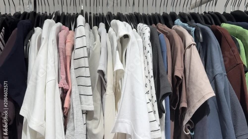 Colorful Casual Clothing Hanging On Rack Inside Modern Fashion Boutique Store