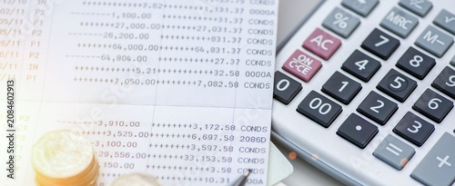 Obraz na plátne Close-up of calculator and financial ledger