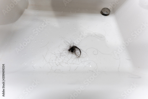 Obraz na plátně Black hair in white sink drain