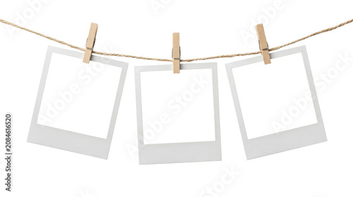 Foto Minimalist blank photo frames on clothesline with wooden clothespins, white pape