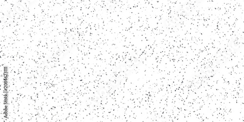 Foto A speckled texture background with small dark gray spots scattered across a clean white canvas, resembling fine grains or digital noise