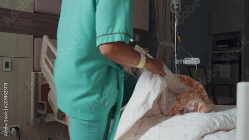 Male patient resting and recovering in a modern hospital room with IV drip, medical bed, and healthcare equipment, representing treatment, recovery, and medical care.