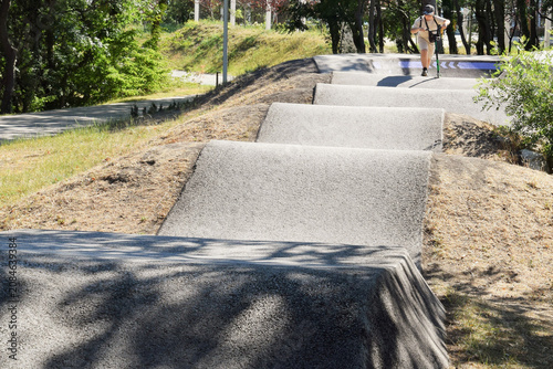 Summer sports. A boy skateboarding on an obstacle course.