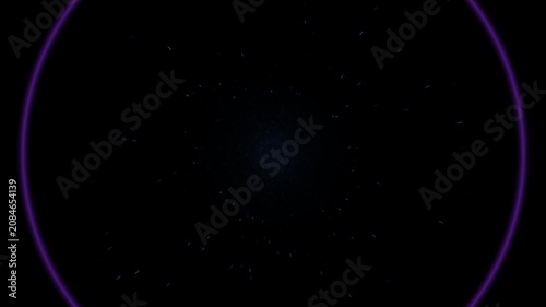 Glowing neon rings with radiating light particles on dark background