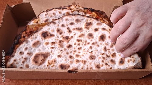 Opening a Box of Traditional Turkish Lahmacun 