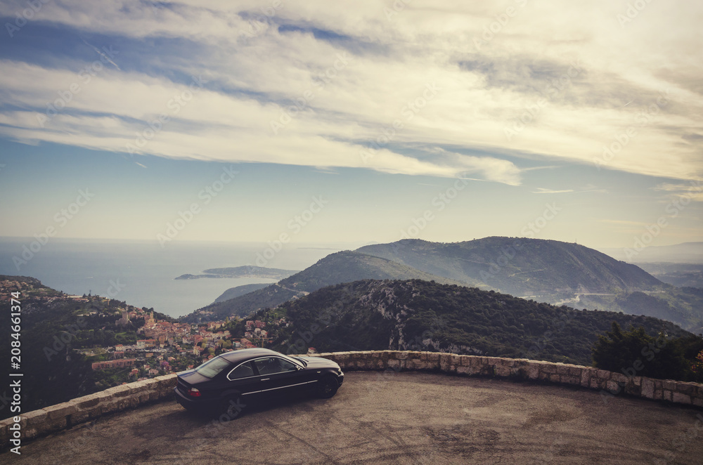 Obraz premium Luxury car parked at eze village overlooking mediterranean sea