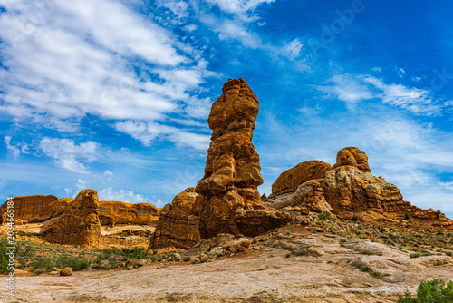 Konstfotografi A towering monolithic sandstone rock spire rising along the scenic drive corridor on the way to Devils Garden in Utah