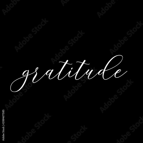 Gratitude word cursive calligraphic text on black background