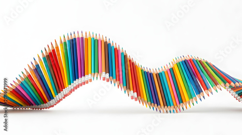 Wave of multicolored wooden pencils arranged in a row isolated on a transparent background