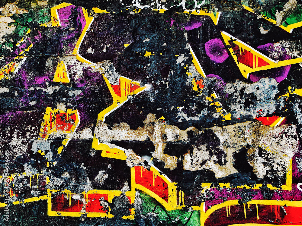 Fototapeta premium Urban graffiti grunge wall texture distressed concrete, colorful street art, weathered paint, peeling surfaces, and abstract urban details. Creative background for posters, branding, print, web design