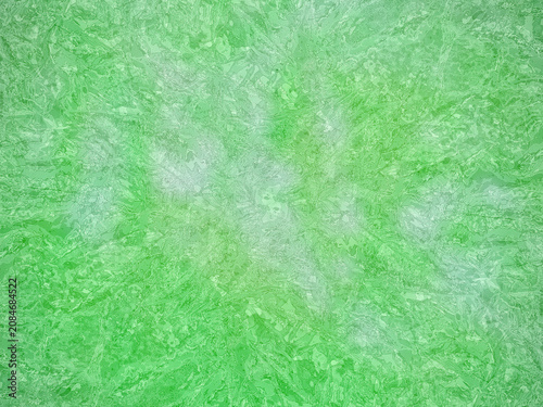 Abstract bright green crumpled foil texture background. Metallic shiny surface with crinkled effect, perfect for festive backdrop, wallpaper, or creative design elements.
