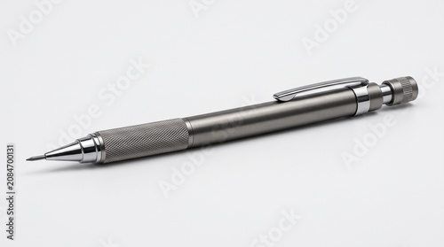 Metallic silver pen, sleek writing instrument, modern office supply, gray desk accessory