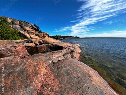 Path of Love on Rocks in Finnish Resort Town Hanko (Hango) and Coastline of the Gulf of Finland of the Baltic Sea.