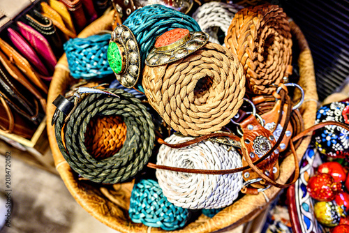 Handcrafted belts in the streets of the old bazaar and Arab market of the Alcaiceria, Granada, Spain