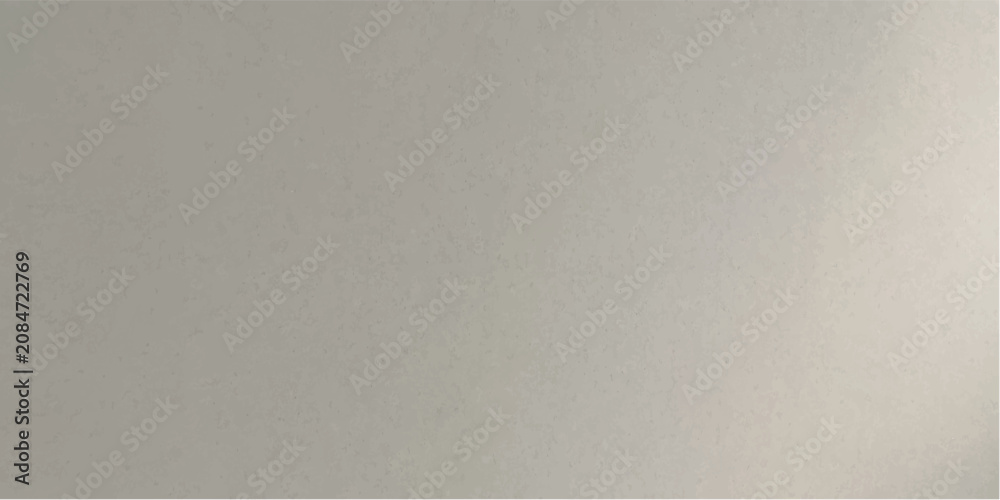 Fototapeta premium A metallic gray textured surface offers a neutral backdrop, subtly catching the light with a soft sheen.