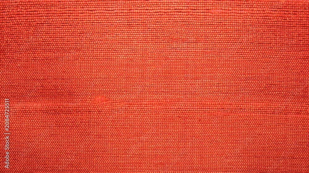 Fototapeta premium Textured Orange Fabric Background Ideal for Design and Art Projects