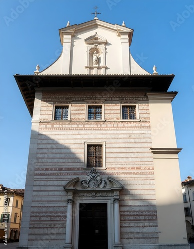 Historic stone clock tower against clear sky.