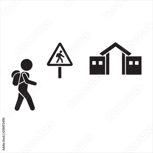 Child walking towards school entrance with black and white, back to school
