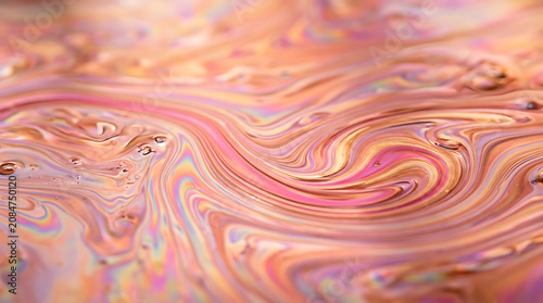 iridescent fluid abstract background, pink and gold oil slick texture, warm pastel colors flowing, smooth liquid surface, macro photography style, ultra high resolution