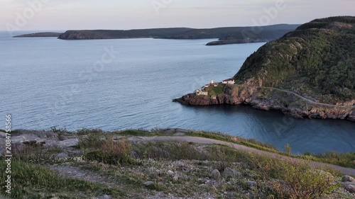 At the sunset, the Narrows entrance of the St John’s harbour with the Fort Amherst (St John’s, Newfoundland, Canada)
