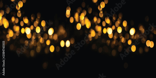 Tableau sur toile Glowing golden bokeh lights on black background with party lights background cel