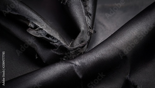Black Fabric Swatch With Frayed Edges