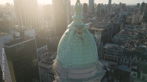City view from above with a focus on a building dome at sunset