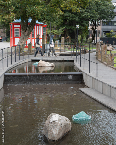 Pedestrians walking in the city center park of Tórshavn, Faroe Islands