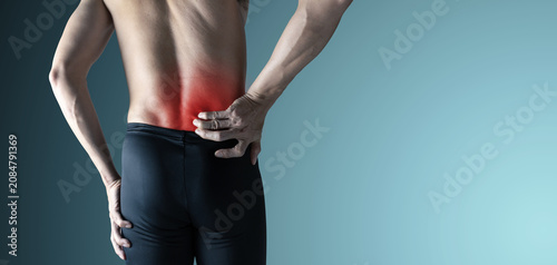 The man experienced back pain in an environment with oblique back lighting.