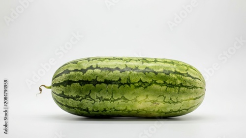 Plakat Fresh whole oblong watermelon isolated on white background