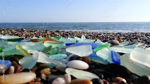 Sea glass, Pieces of sea glass isolated on white background, Green pieces of glass polished by the sea closeup background. A pile of natural beach glass, Multi colored pieces of polished glass. Colore