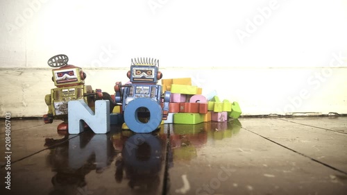retro robot toys say NOT AI with wooden letters stop motion 