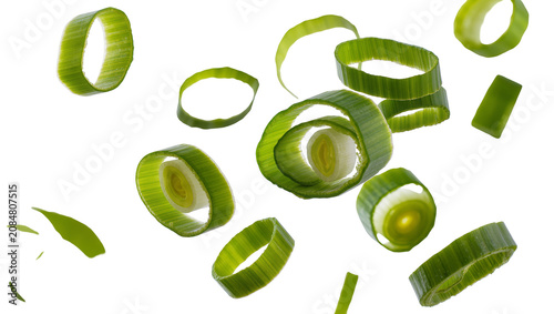 Cuadro en lienzo Isolated fresh green onion slices and rings falling, scattering against a clean