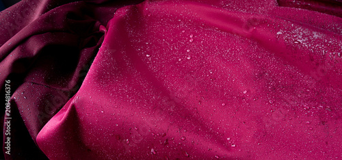 Fotografie Waterproof fabric texture with rain drops closeup