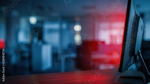 Close up of a computer monitor in a modern office setting with soft lighting and a focus on technology