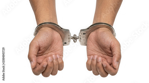 Closeup of hands in metal handcuffs isolated on transparent background
