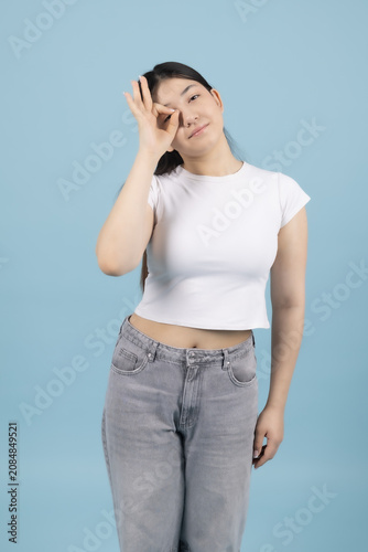 Young woman suffering from headache touching her forehead with hand