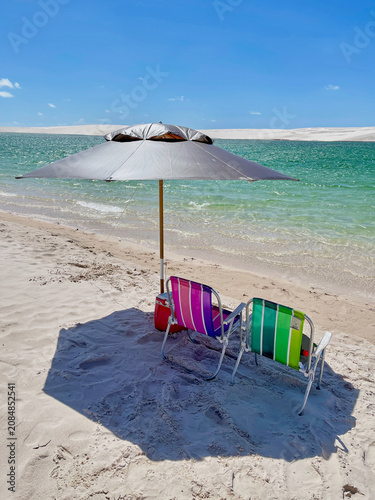 beach chairs and umbrella on beach