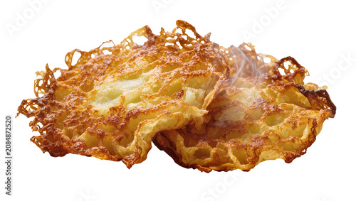 Obraz na plátne Isolated freshly cooked golden crispy fried potato fritters with a subtle wisp o