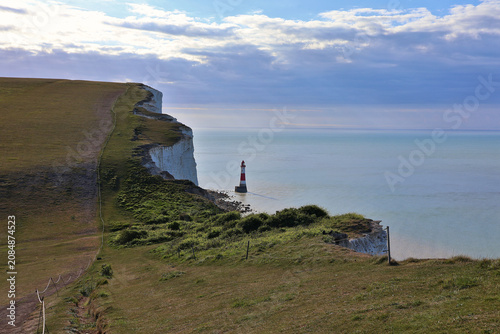 Obraz na płótnie Iconic red and white Beachy Head Lighthouse, South Downs National Park; dramatic
