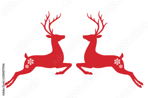 Фотография Red deer silhouettes with snowflakes on white background  two reindeer in mid st