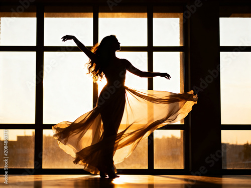 silhouette of a girl in a window