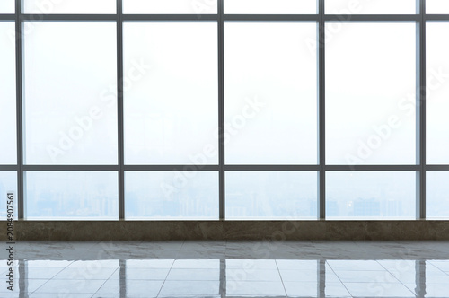 Obraz na plátně Interior observation area with large panoramic windows overlooking an urban landscape