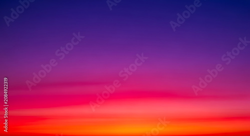 Sunset sky with purple pink orange hues color blend gradient twilight atmosphere beautiful dramatic abstract background colorful