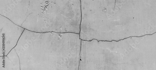 Photography Concrete wall texture with large cracks and numerous crack lines.