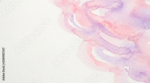 Soft pink and purple watercolor wash on white paper